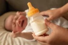 Baby Pushing Bottle Away But Still Hungry? Reasons & Solution